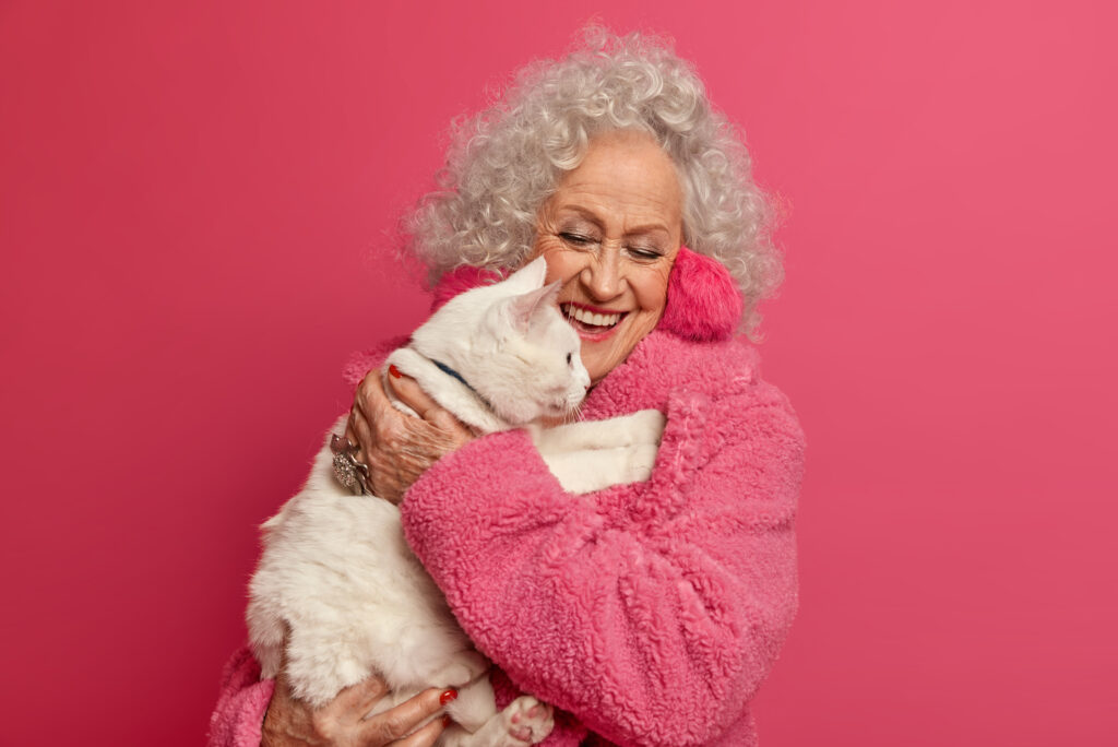 Owner holding senior cat lovingly